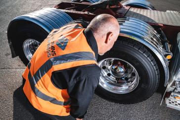 National Workshop Manager Andy Mickan inspects the Bridgestone M866 tyres.